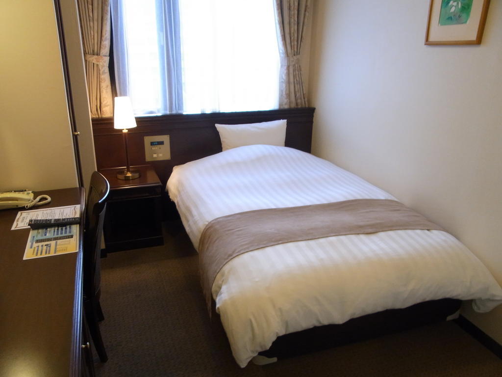 Amami Sunplaza Hotel Ruang foto
