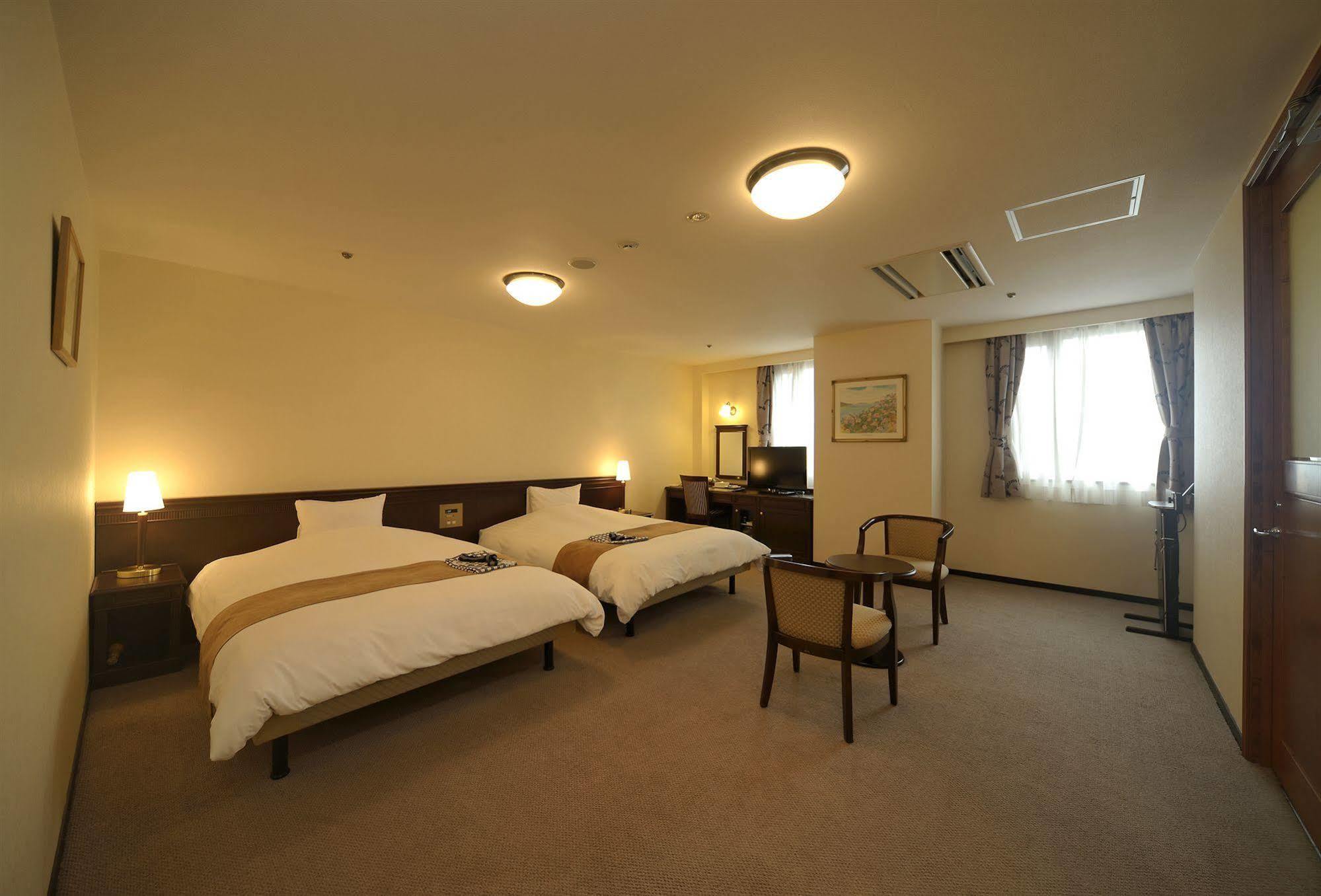 Amami Sunplaza Hotel Bagian luar foto