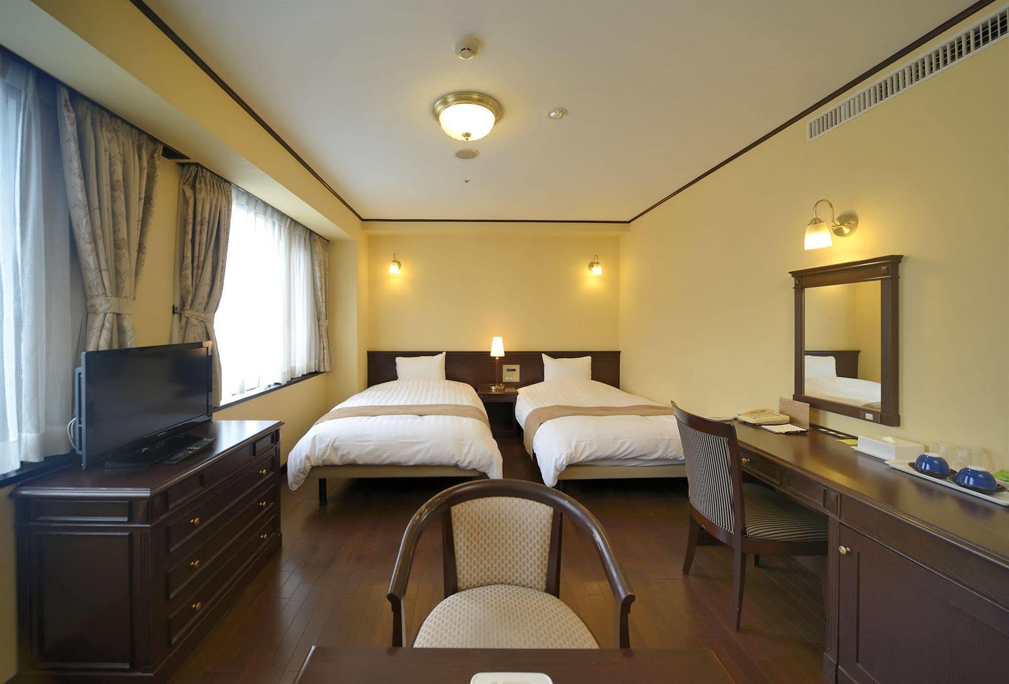 Amami Sunplaza Hotel Bagian luar foto