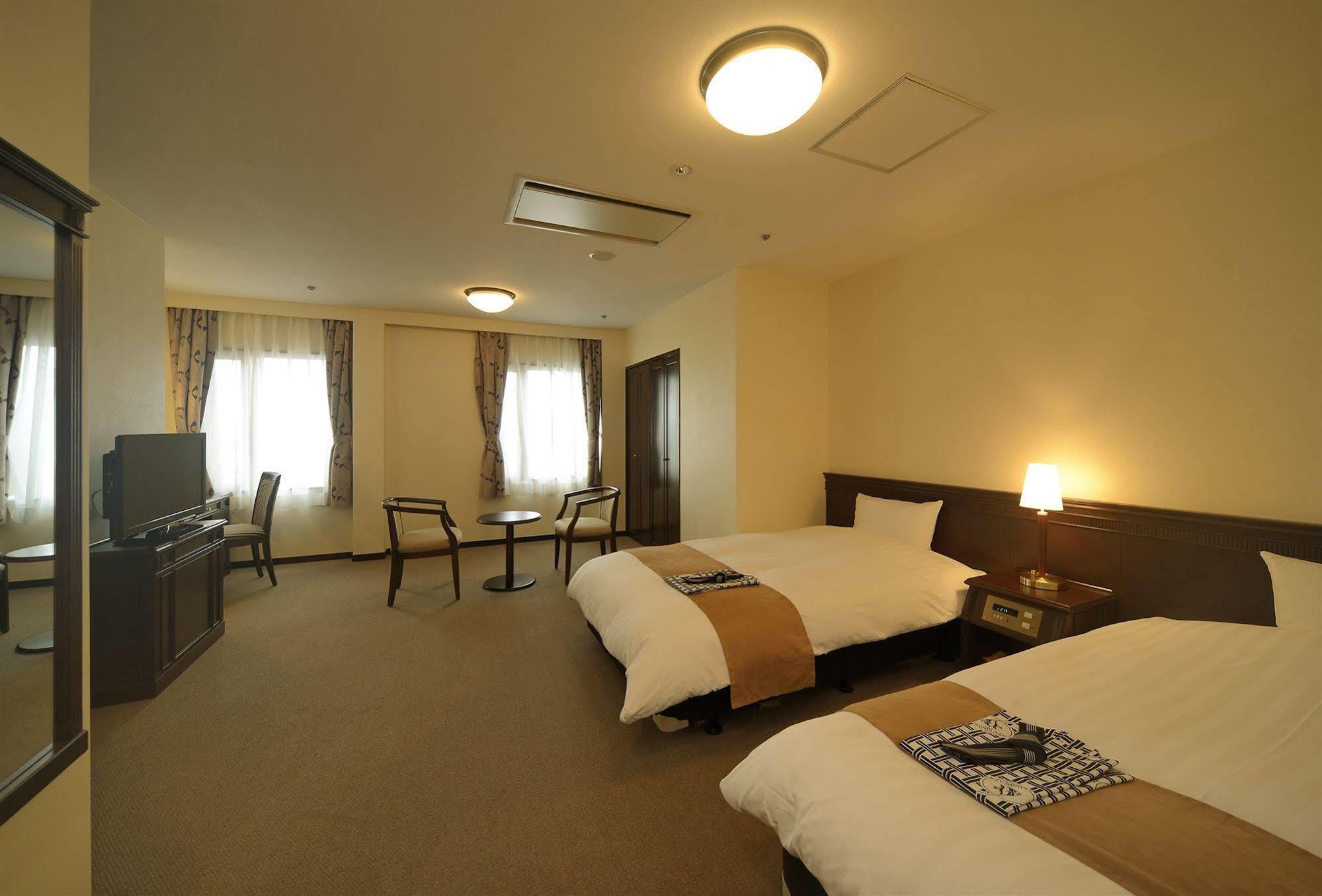 Amami Sunplaza Hotel Bagian luar foto