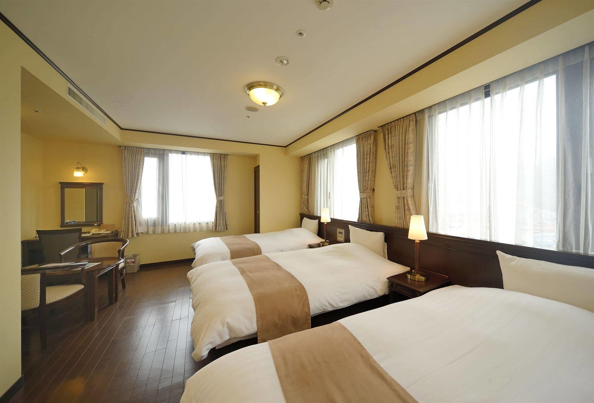 Amami Sunplaza Hotel Bagian luar foto